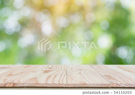 Empty wood table top and blur nature background Empty wood table top and blur nature background 54110203