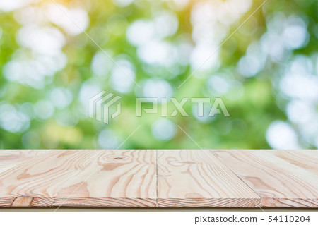 Empty wood table top and blur nature background Empty wood table top and blur nature background 54110204