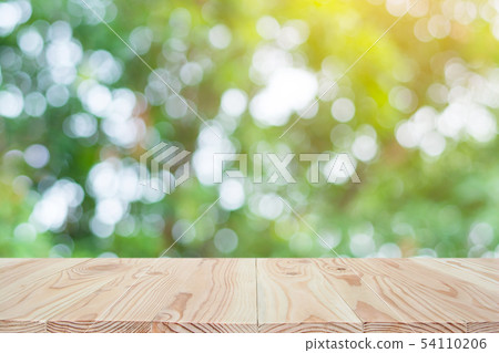 Empty wood table top and blur nature background Empty wood table top and blur nature background 54110206