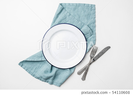 Table setting with empty plate, cutlery and linen Table setting with empty plate, cutlery and linen 54110608