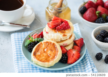 Cottage cheese pancakes with strawberries and Cottage cheese pancakes with strawberries and 54110609
