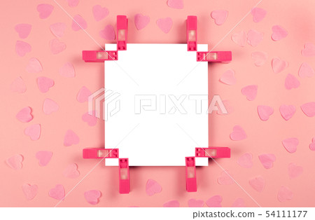 Sheet of paper on pink decorated background. Sheet of paper on pink decorated background. 54111177