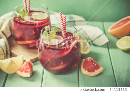 Sangria and ingredients in glasses Sangria and ingredients in glasses 54115513