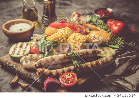 Barbeque sausages with vegetables Barbeque sausages with vegetables 54115514