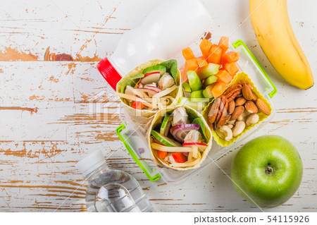 Lunch to go with tortilla wraps and vegetables 54115926