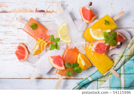 Colorful popsicles on rustic wood background 54115996