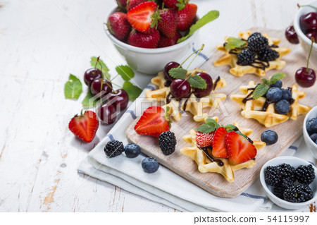 Colorful waffles with different berries 54115997