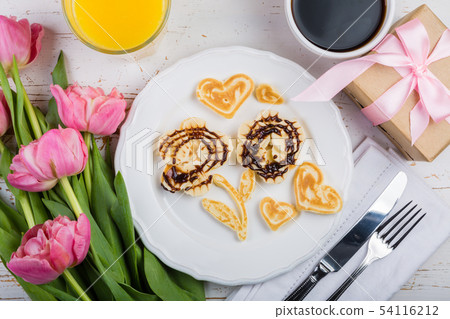 Mother's day breakfast concept - pancakes, coffee, flowers, present 54116212
