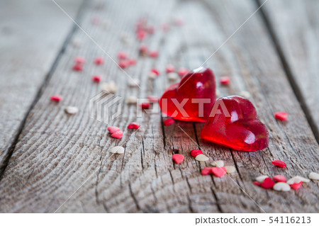 Valentine's day concept - heart shaped sweets on rustic background Valentine's day concept - heart shaped sweets on rustic background 54116213