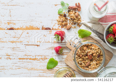 Breakfast - yogurt with granola and straberries 54116217