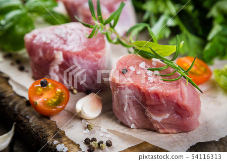 Raw filet mignon meat cuts with spice and herbs Raw filet mignon meat cuts with spice and herbs 54116313