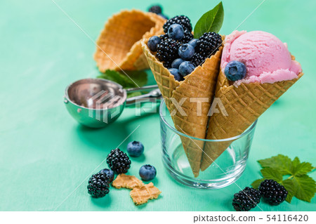Berry ice cream on rustic wood background Berry ice cream on rustic wood background 54116420