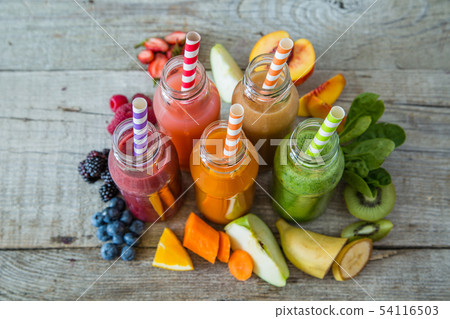 Selection of colourful smoothies on rustic wood background Selection of colourful smoothies on rustic wood background 54116503