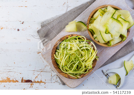 Raw zucchini pasta on white background 54117239