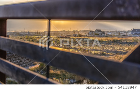 Scenic view seen through the railings of a bridge 54118947