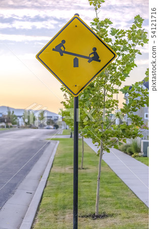 Playground sign on a sunny street in Daybreak Utah 54121716