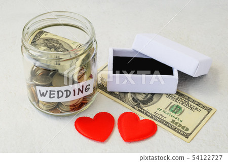 Wedding word, coins and dollar bill in a glass jar Wedding word, coins and dollar bill in a glass jar 54122727