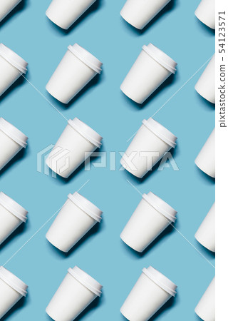Lot of paper cups on blue background Lot of paper cups on blue background 54123571