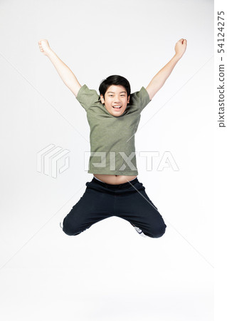 Portrait of happy little Asian child jumping Portrait of happy little Asian child jumping 54124275