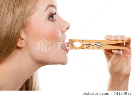 Blonde woman having tongue in clothespin 54124952