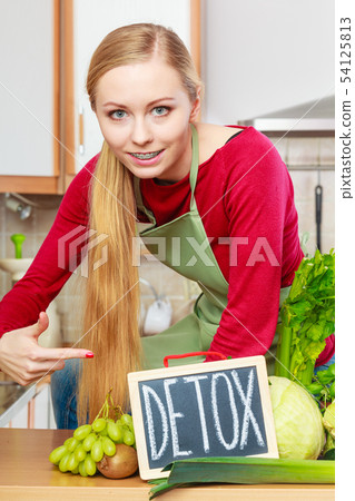 Woman having green diet vegetables, detox sign 54125813