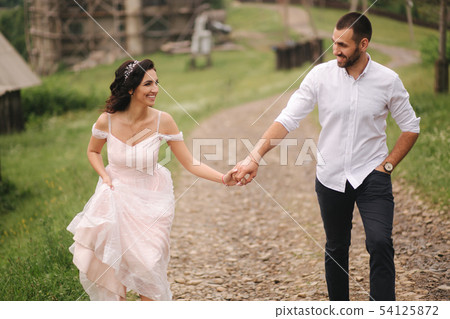 Beautiful wedding couple in Carpathian mountains. Handsome man with attractive woman 54125872