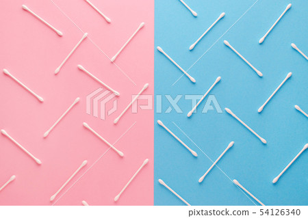 pink and blue background and white cotton swabs, flat lay pink and blue background and white cotton swabs, flat lay 54126340