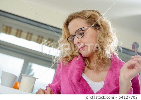 blonde woman in pink bathrobe blonde woman in pink bathrobe 54127702