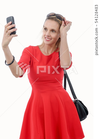 young woman with a red dress on white 54128483