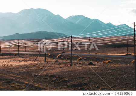 beautiful landscape of electric wires gleaming in the sun on the hills background 54129865