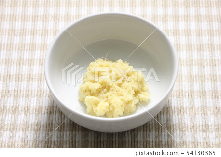 Grated ginger. Grated ginger. 54130365