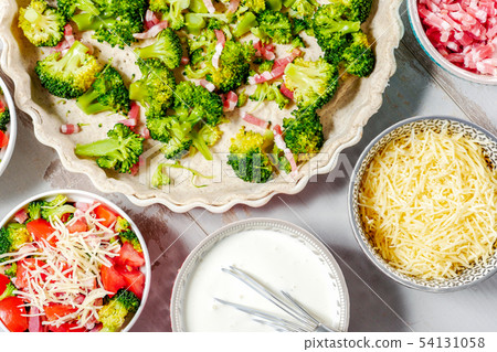 preparation of french  quiche with tomatoes and 54131058