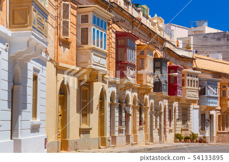 Traditional colorful wooden balconies, Malta 54133895