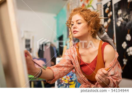 Dark-eyed artist with brassy hair painting at the weekend Dark-eyed artist with brassy hair painting at the weekend 54134944