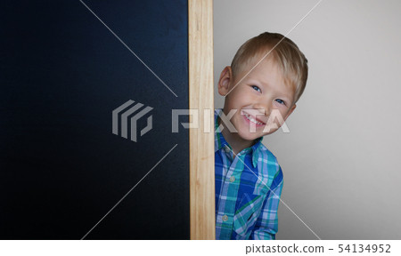 Blackboard and little schoolboy - space for text. 54134952