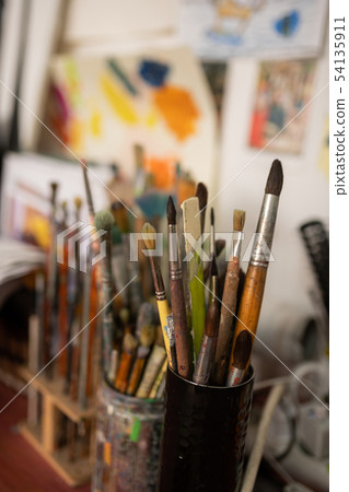 Close up of different brushes for painting standing on the table 54135911