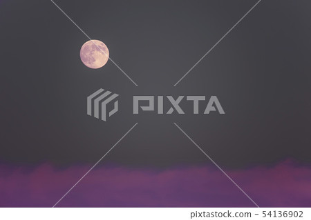 A landscape with a full moon over the evening clouds and the full moon and evening clouds 54136902