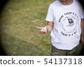 Child picking up a kite 54137318