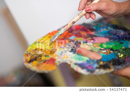 Close up of bright gouache of different colors on color palette Close up of bright gouache of different colors on color palette 54137471