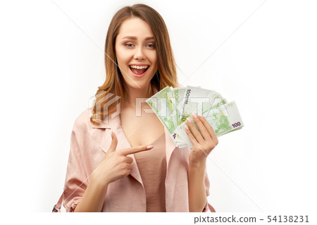 A stylish young woman holds a large amount of cash A stylish young woman holds a large amount of cash 54138231