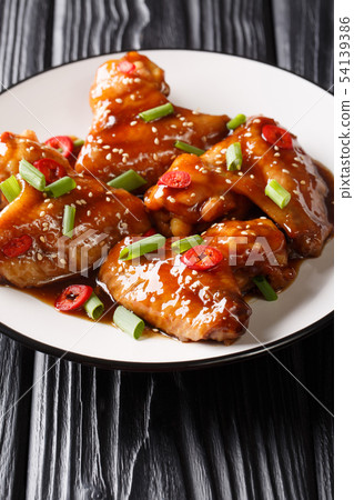 Delicious chicken wings with sesame in teriyaki 54139386