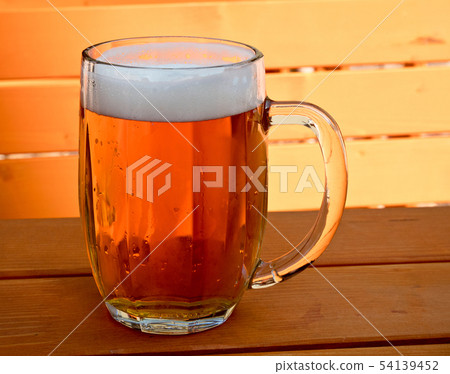 Beer on the desk in a garden restaurant Beer on the desk in a garden restaurant 54139452