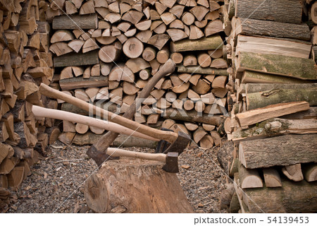A old axe with fire wood A old axe with fire wood 54139453