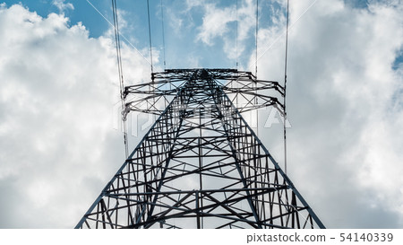A high-voltage electricity pylon against blue sky A high-voltage electricity pylon against blue sky 54140339