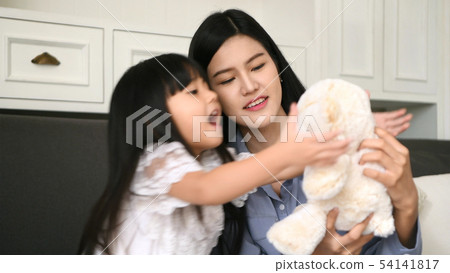 Family concept. The mother is teasing the daughter Family concept. The mother is teasing the daughter 54141817