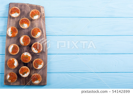Tartalets with red caviar Tartalets with red caviar 54142899