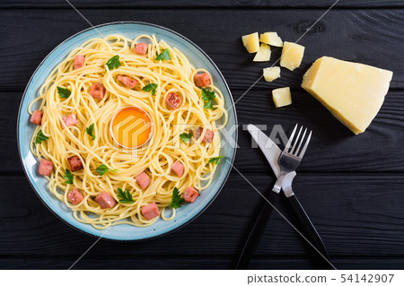 Itslian pasta carbonara with sausage and egg 54142907