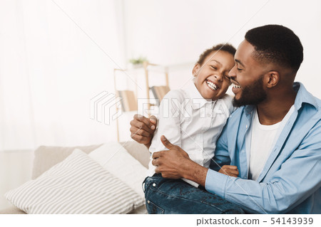 Afro Father Tickling Daughter, Having Fun And Playing At Home 54143939