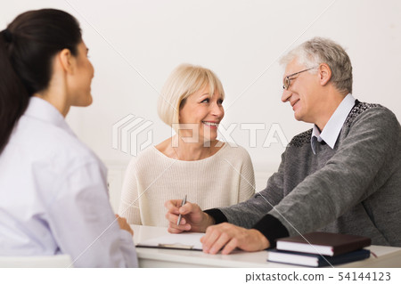 Elderly Couple Buying Medical Health Insurance And Consulting Broker 54144123