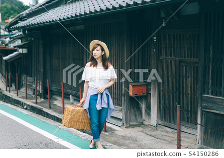 Woman traveling the old town Woman traveling the old town 54150286